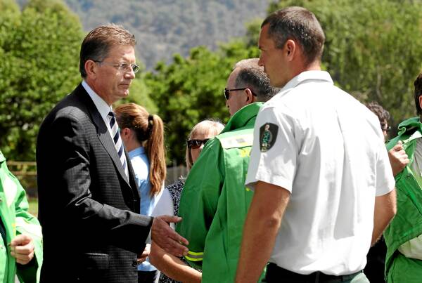 Victorian Premier Ted Baillieu comforts DSE employees after the service.