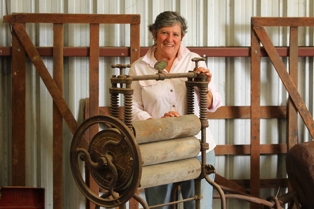 Julie de Hennin with a mangle, which is part of a collection that belonged to her father Clem Orton. 