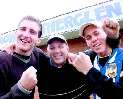 Damian, Brian and Josh Houlihan celebrate Corowa-Rutherglen’s senior and thirds premierships in 2000.
