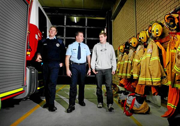Firefighters Bryce Willoughby and David Brown, from the Wodonga Fire Station, speak with hopeful candidate Kaine Splatt, of Point Cook, last night at the information night. Picture: MATTHEW SMITHWICK