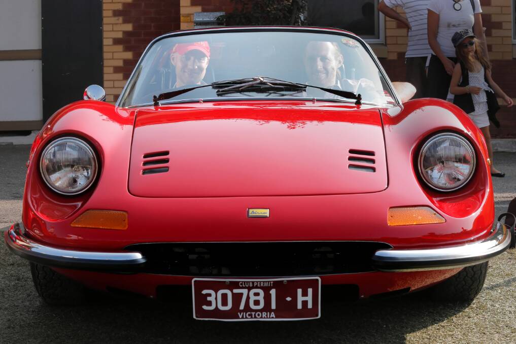 Ferrari Club of Victoria president Trent Smyth shows off his pride and joy to event organiser Steve Carne, of Broadgauge, in Wodonga at the weekend. Pictures: TARA GOONAN