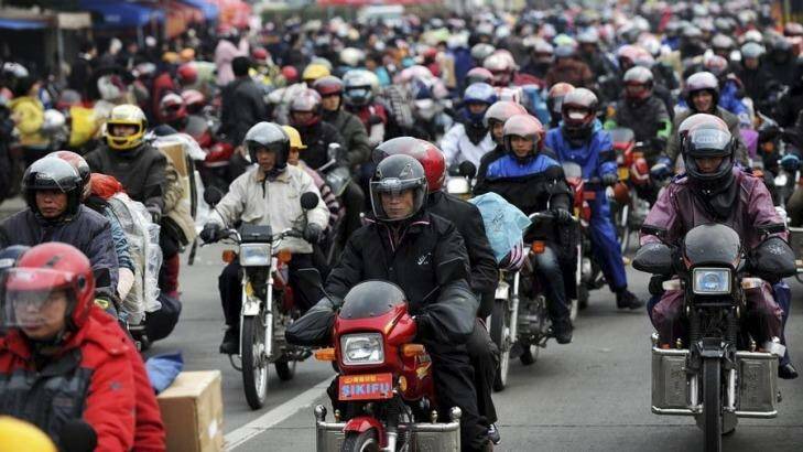 About 400,000 people will travel home by motorcycle for the annual Spring Festival break. Photo: ChinaFotoPress