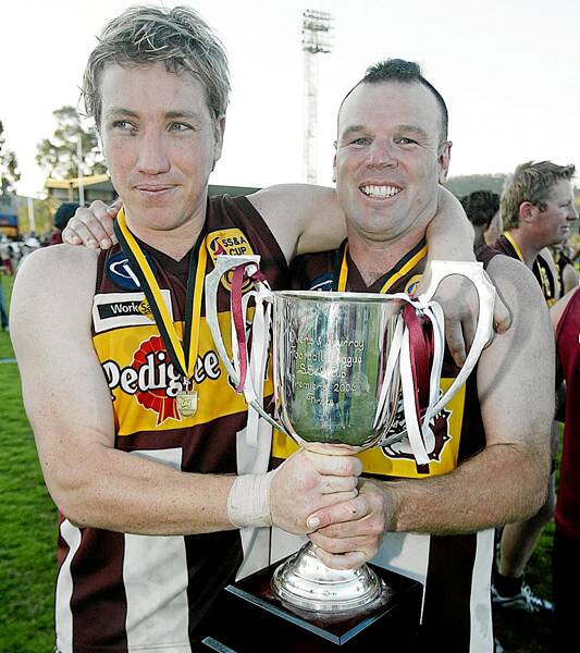 Brad Thompson and Danny Cohen with the Bulldogs’ 2004 premiership cup.