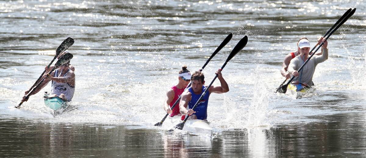 Adele Walker and Stewart Nicol, from Footscray, competing in the veterans mixed section, power ahead.