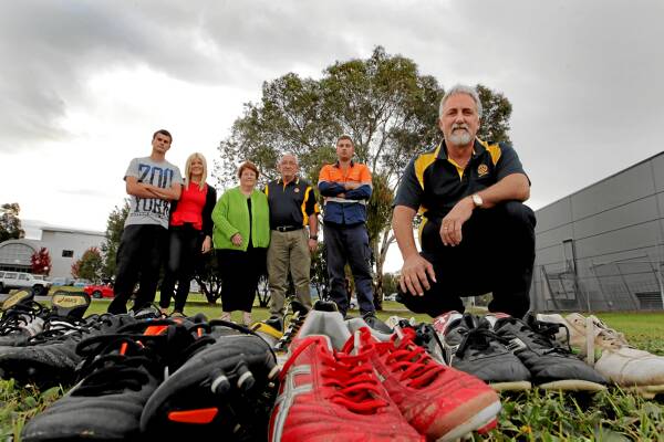 Rotarian Peter Frauenfelder, with Casey Stuart, Maddie Wileman, Jean Burke, Michael Burke and Ky Prendergast, checks out sports gear they will take to Fiji in August. Picture: DAVID THORPE