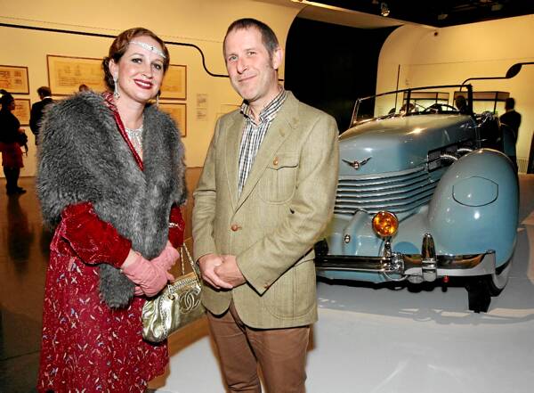 ABOVE: Tracey Judd Iva and Professor Adrian Franklin in front of a 1937 Cord 810 sports car, painted in “Eleanor Blue”.RIGHT: Joel Horner and friend Jessica Goodvinn, both of Wodonga, looking at an Indian motor bike, one of the many art deco displays.Pictures: PETER MERKESTEYN