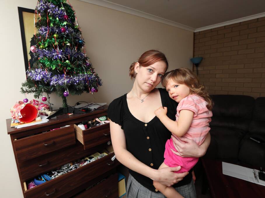 Corowa mum Melanie Stephens, with her daughter Ella Stephens, 2, warned residents to lock-up and secure their homes after her home was broken into and ransacked just days before Christmas. Picture: Peter Merkesteyn