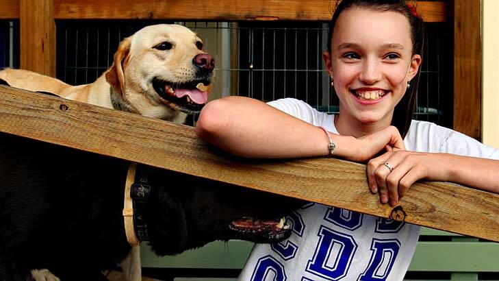 Understanding … Felicity Jackson, with her dogs Gracie and Bella, was teased about her Tourette symptoms but says life became easier after her mother explained the condition to her classmates.