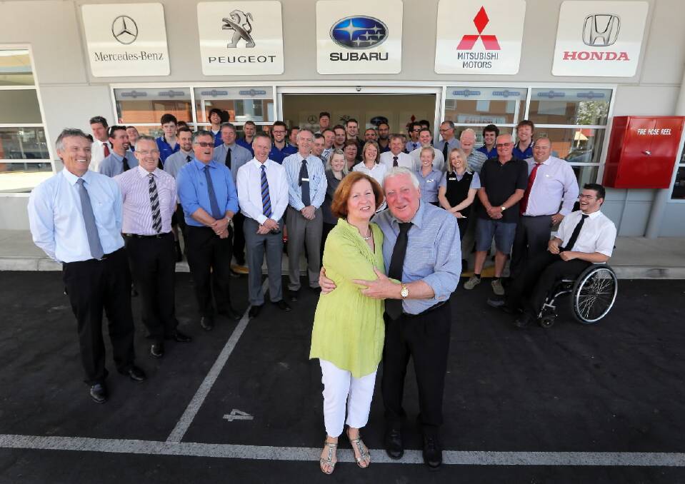 Sue and Ken Bailey celebrate his 50 years at Baker Motors with owners and staff. Picture: Tara Goonan