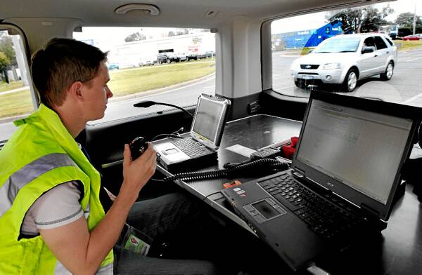 Road safety officer Brendan Zalewski with the number plate recognition system. Picture: PETER MERKESTEYN