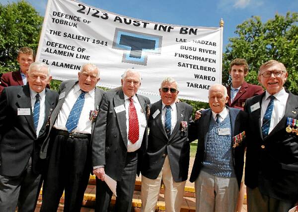 2/23 Battalion veterans Bob Iskov, Ken Bartel, Edward Kelly, Jim Arkell, William Woods and Don Tibbits in November 2008. Students Sam Beverly and Matthew Reid hold the banner. Picture: JOHN RUSSELL