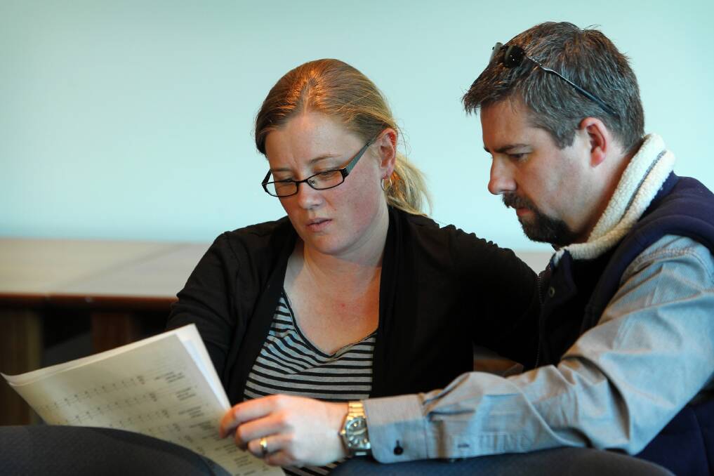 Lauren McCully and husband Paul go over the results of the countback. Picture: MATTHEW SMITHWICK