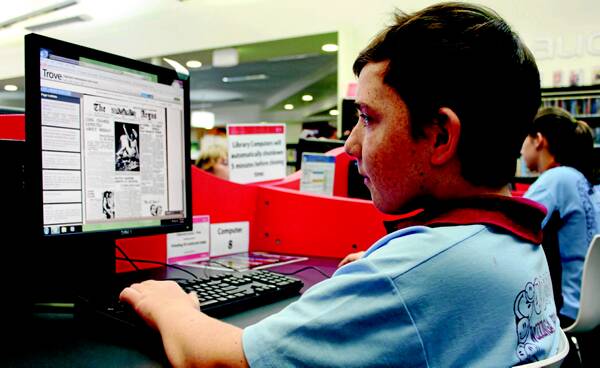 Wodonga Primary School student Kade Bogie looks up the Trove database at Wodonga library recently.