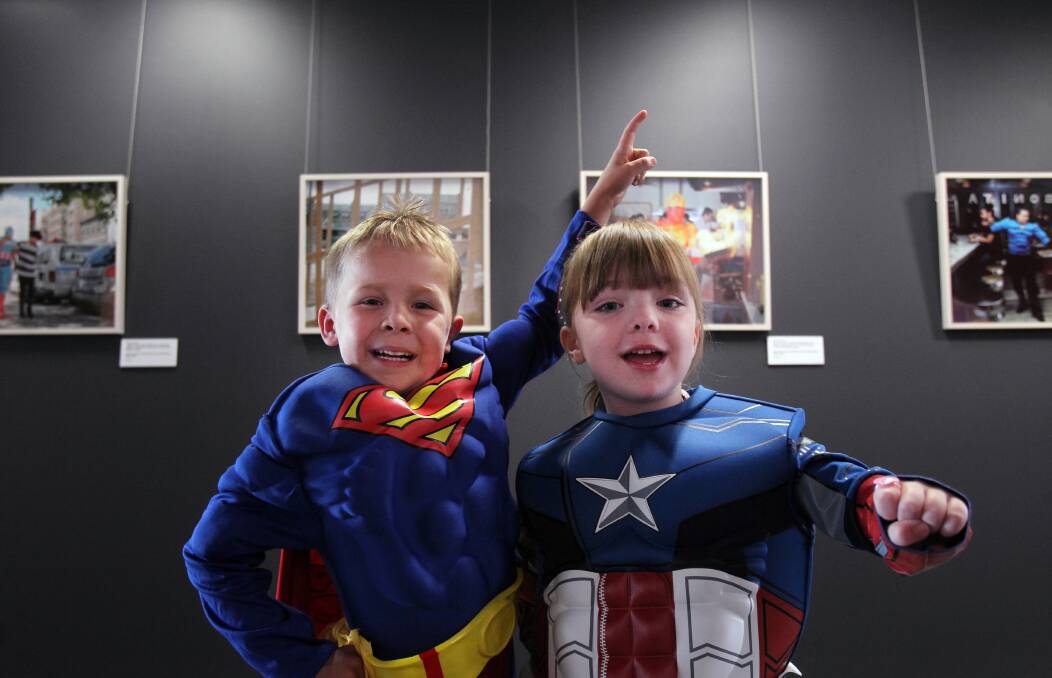 For Harry Semmler, of East Albury, and Lucy Jacka, of Howlong, superhero characters are larger than life. Picture: MARK JESSER
