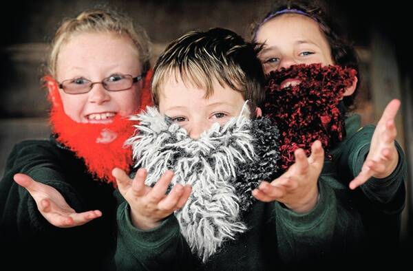 Maddison Lawrence, 7, Cody Christopoulis, 9, and Ruby Lang, 8, all of Beechworth Primary School, get into the spirit of competition. Picture: JOHN RUSSELL