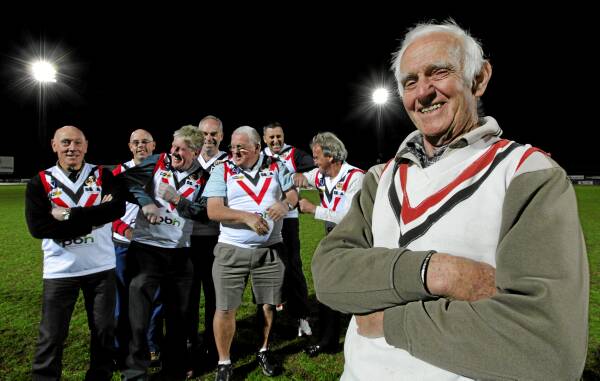 Wearing the old Lavington Football Club Saints jumpers are Wayne Styles, Steve Chalmers, Neil Palmer, Peter Barwick, Dave Thomas, Tim Sanson, Happy Wetmore and Ian “Knuckles” Grayland. The club’s current players will wear the colours in their match tomorrow. Picture: KYLIE GOLDSMITH