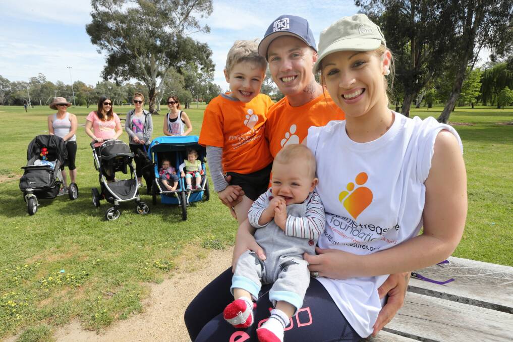 Sarah and Ty Sheridan with sons Orlando, 9 months, and Boston, 4. She is determined to make the walk for the Life’s Little Treasures foundation an annual event. Picture: PETER MERKESTEYN