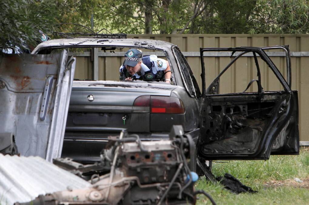 This Commodore was set alight in the backyard of a West Albury home yesterday. Picture: MARK JESSER
