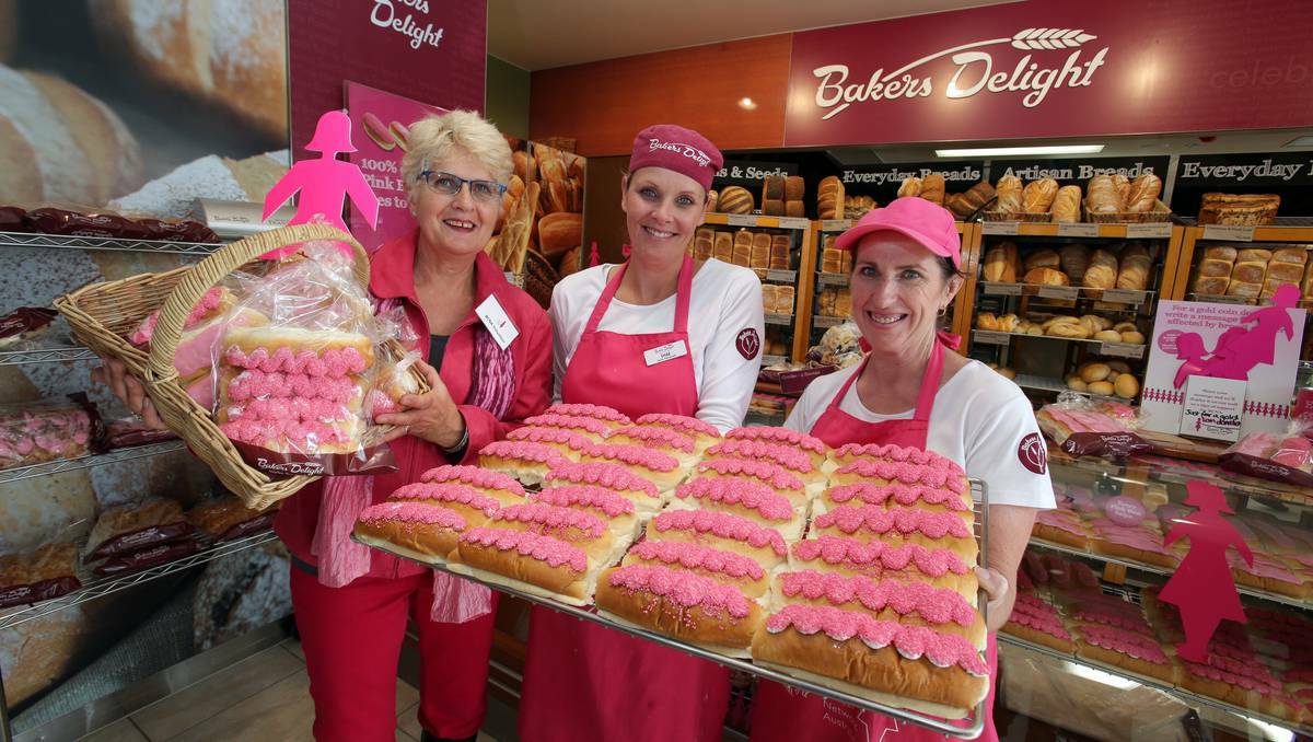 Breast Cancer Network Australia volunteer Ann Krause with Baker's Delight Target Centre staff in Warrnambool Shae Whitehead and Donna Rowan, showing their pink icing buns on sale to raise money for breast cancer research. Photo: Damian White