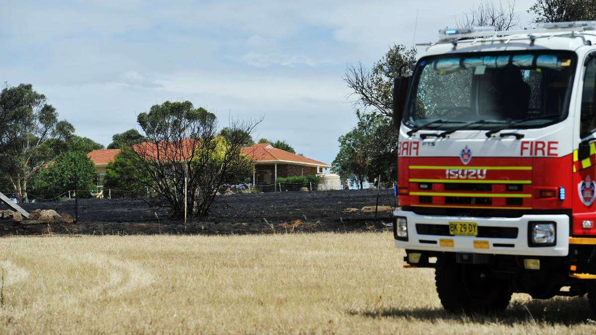 A mower is believed to have sparked a grass fire which burned close to two homes near Wagga on Friday. Picture: Alastair Brook