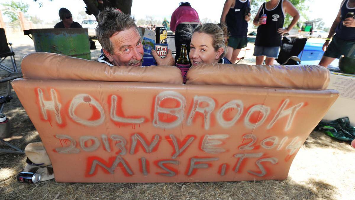 Darwin's Steve Riley and Jess Tye show off their customised furniture at the Holbrook New Year's Eve BnS Ball. Picture: Alastair Brook