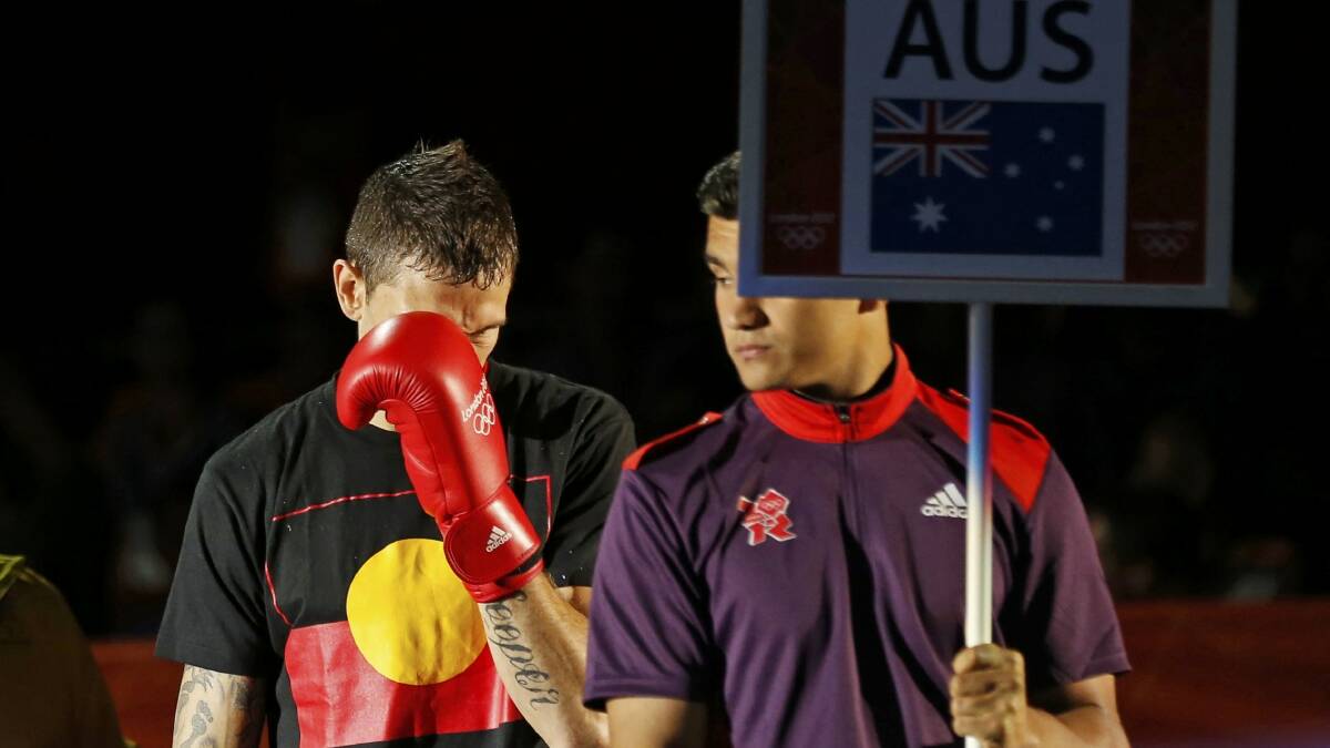 Damien Hooper wearing an indigenous t-shirt before his opening bout at the London Olympics.