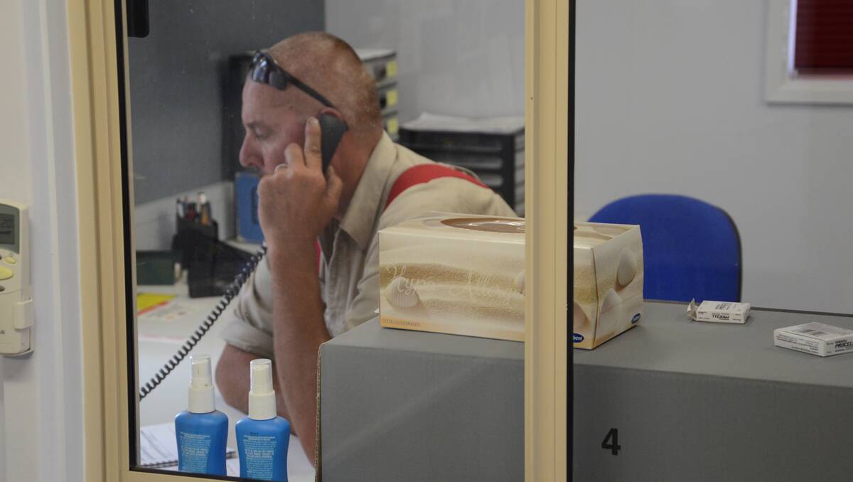 Callington CFS Captain Quenton Hausler works the phones at the station