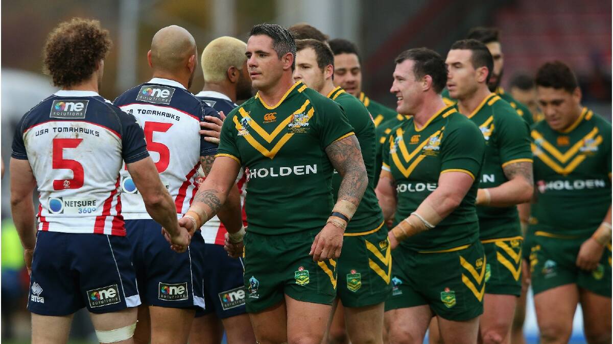 Corey Parker of Australia shakes hands with Matthew Petersen of USA after the Rugby League World Cup Quarter Final match between Australia and the USA. Photo: Getty Images.