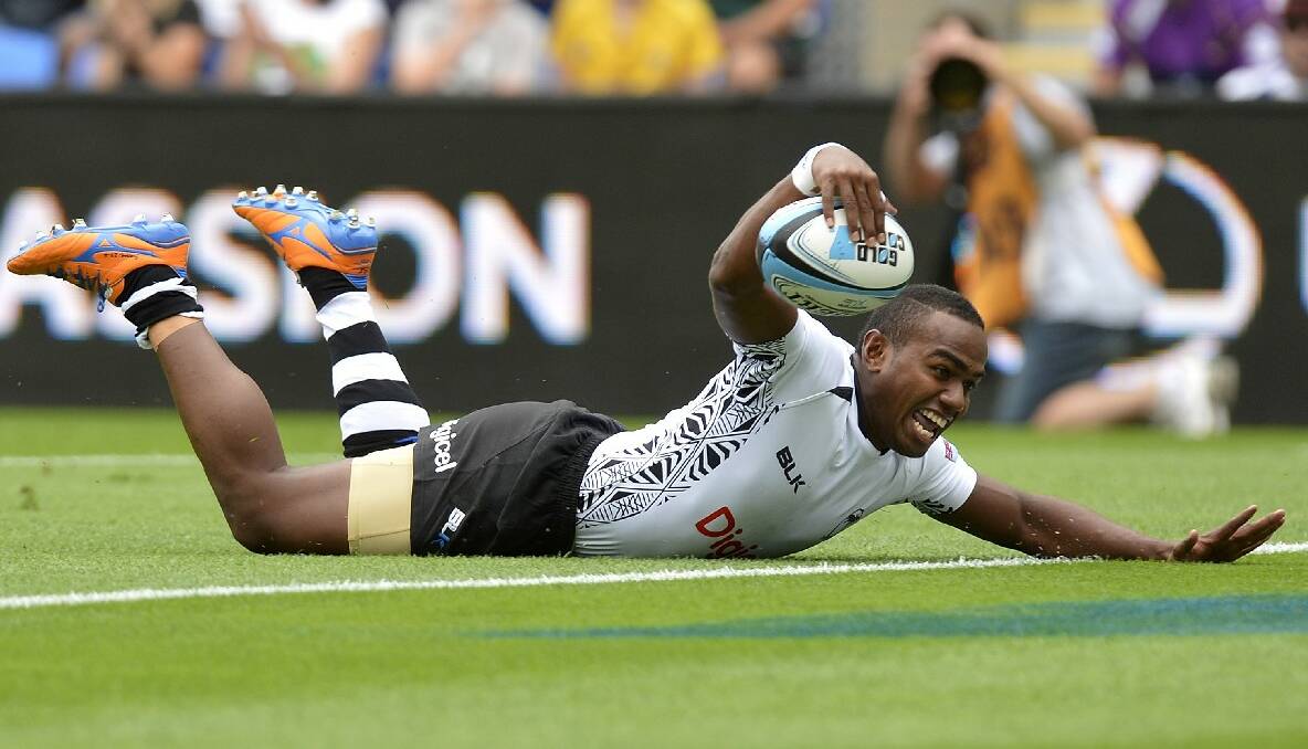 Waisea Nacuqu of Fiji celebrates as he scores a try during the Gold Coast Sevens round one match between Fiji and Canada. Photo: Getty Images.