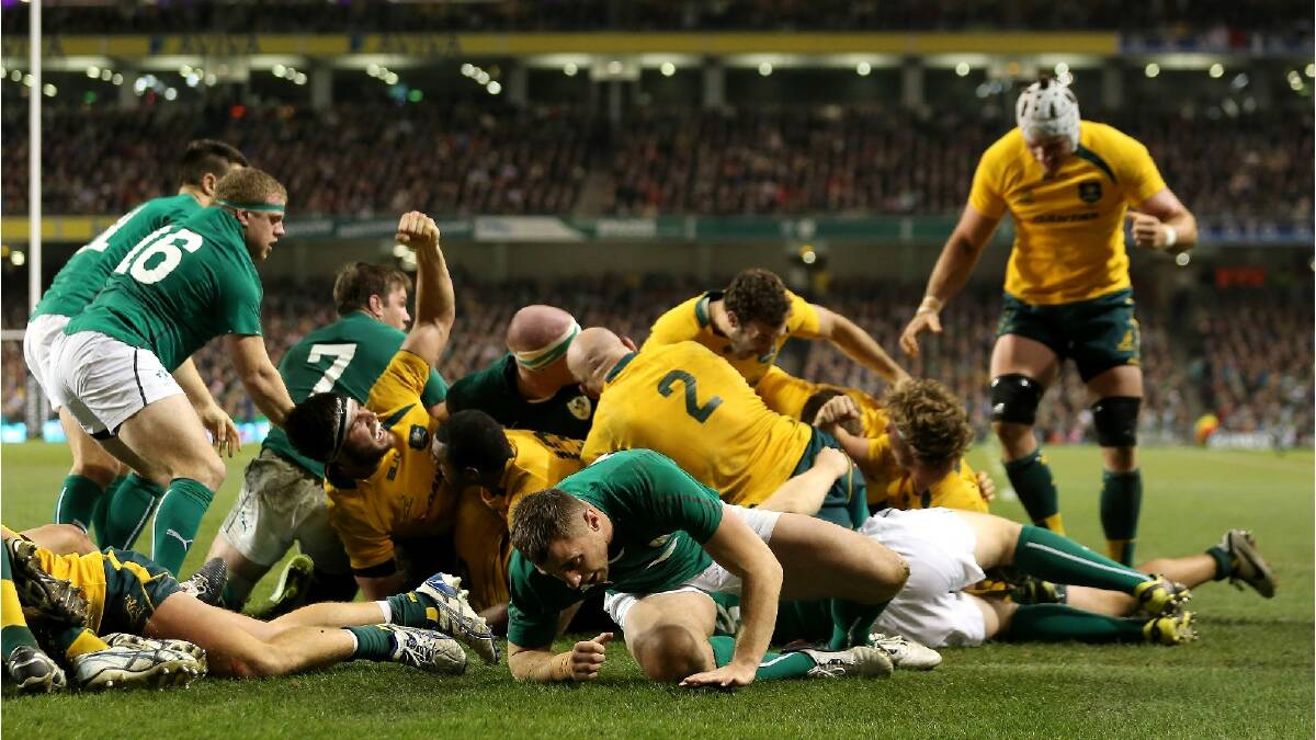 Michael Hooper of Australia scores a try during the International match between Ireland and Australia. Photo: Getty Images.