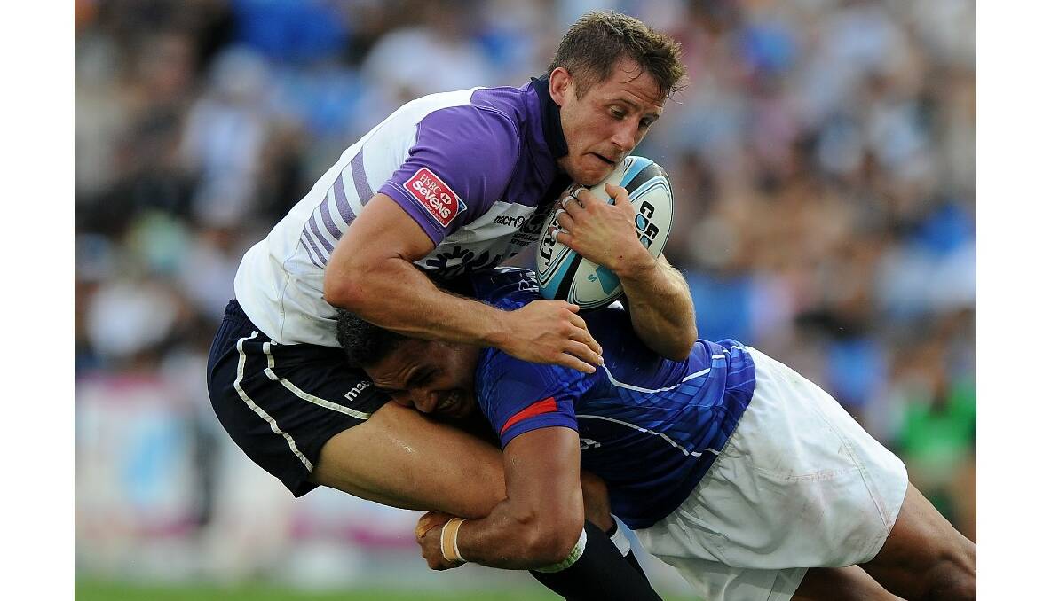 Mark Robertson of Scotland is tackled during the Gold Coast Sevens round one match between Samoa and Scotland. Photo: Getty Images.