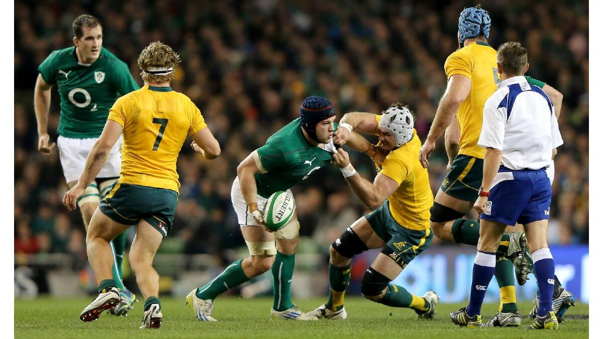 Ben Mowen of Australia tries to tackle Sean O'Brien of Ireland during the International match between Ireland and Australia. Photo: Getty Images.