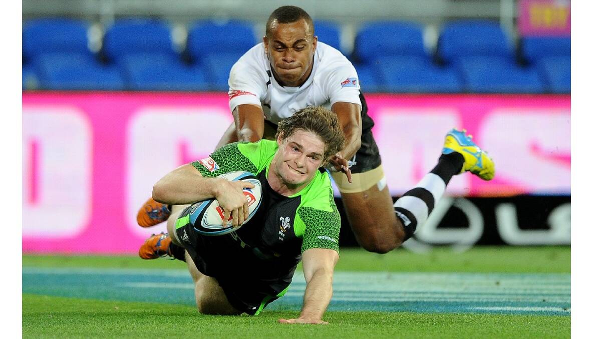 Chris Knight of Wales scores a try during the Gold Coast Sevens round one match between Fiji and Wales. Photo: Getty Images.
