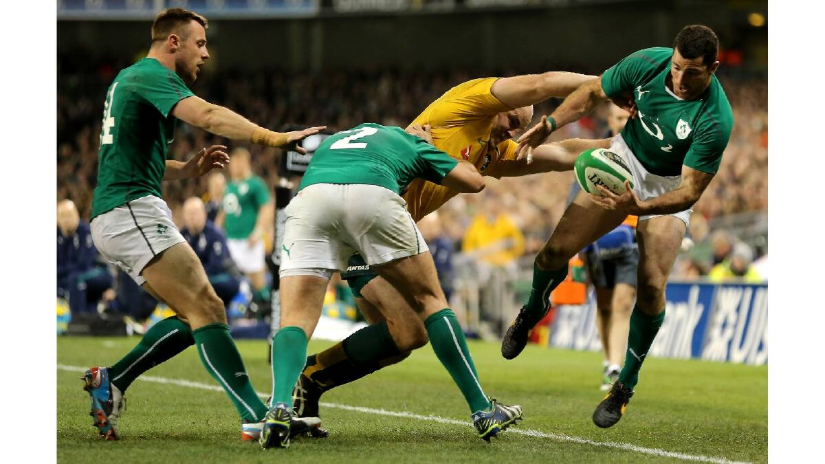 Stephen Moore of Australia tries to tackle Rob Kearney of Ireland during the International match between Ireland and Australia. Photo: Getty Images.