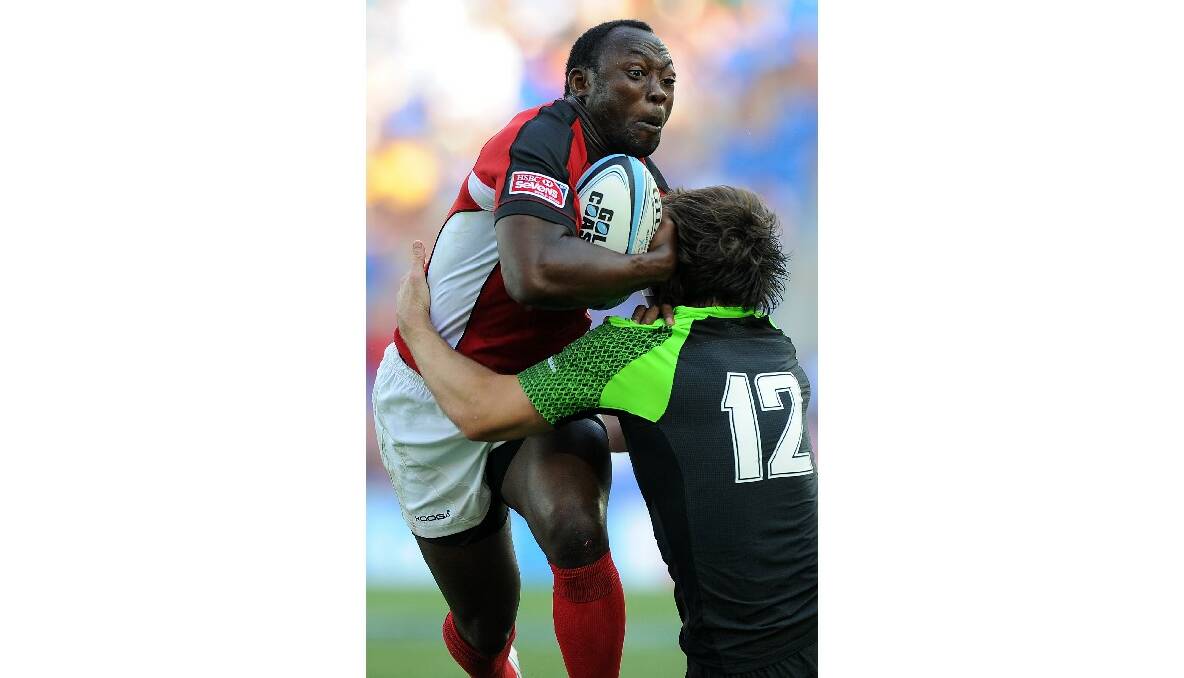 Nanyak Dala of Canada is tackled during the Gold Coast Sevens round one match between Wales and Canada. Photo: Getty Images.