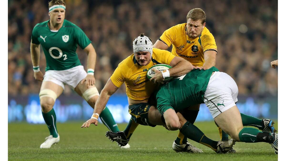 Ben Mowen of the Wallabies is tackled by Cian Healy of Ireland during the International match between Ireland and Australia. Photo: Getty Images.