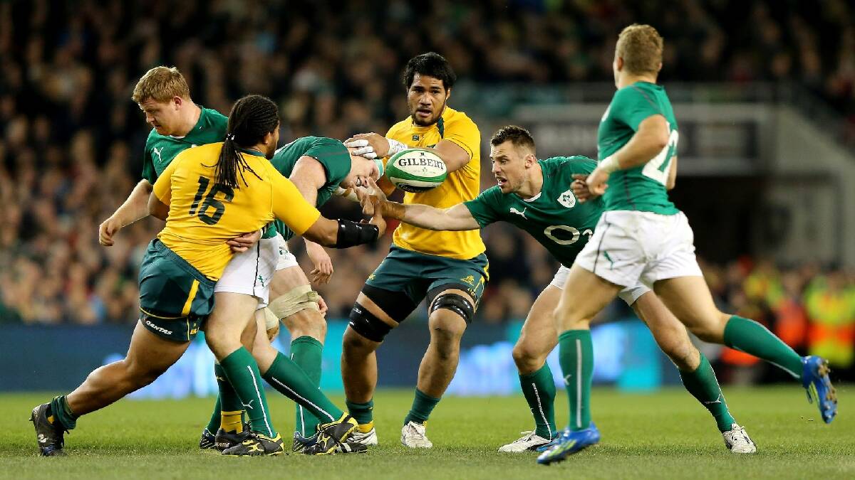 Tatafu Polota Nau of Australia tries to tackle Paul O'Connell of Ireland during the International match between Ireland and Australia. Photo: Getty Images.