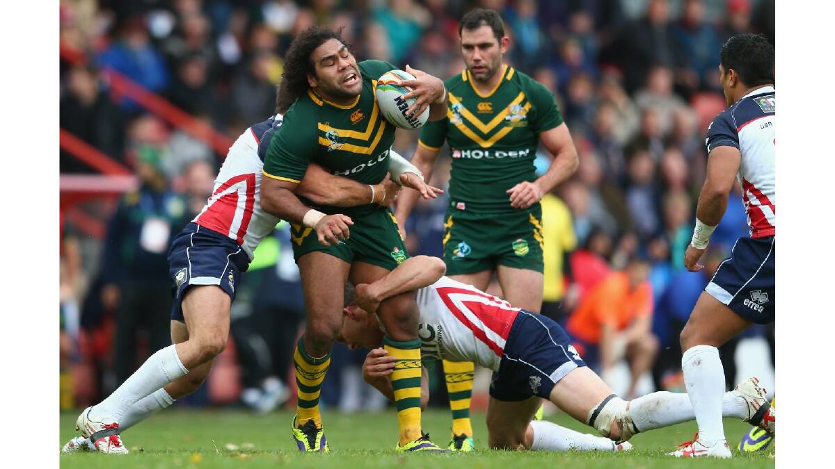 Sam Thaiday of Australia is held up during the Rugby League World Cup Quarter Final match between Australia and the USA. Photo: Getty Images.