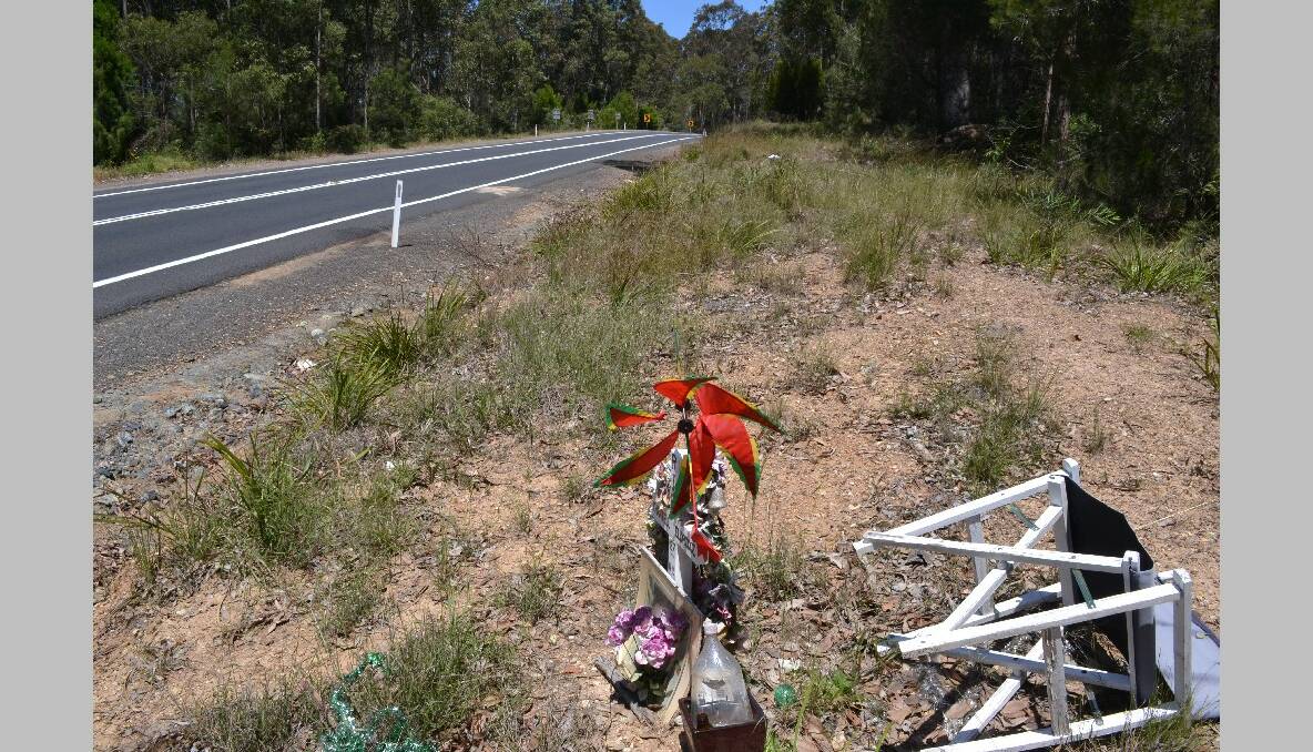 METRES AWAY: The motorcyclist came to rest mere metres away from the roadside memorial to local woman Chantell Eldridge killed on the same corner of the Princes Highway. 