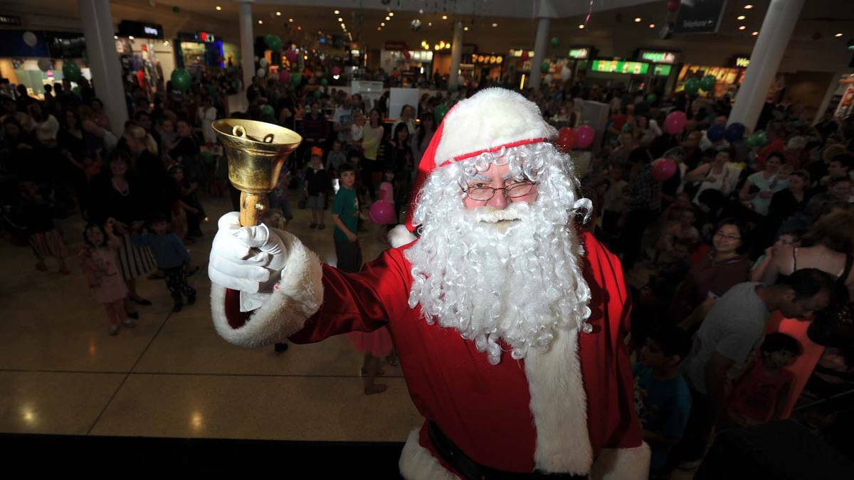 DAILY ADVERTISER: An early sighting - Santa was greeted by thousands when he arrived at the Markatplace on Thursday. Picture: Addison Hamilton
