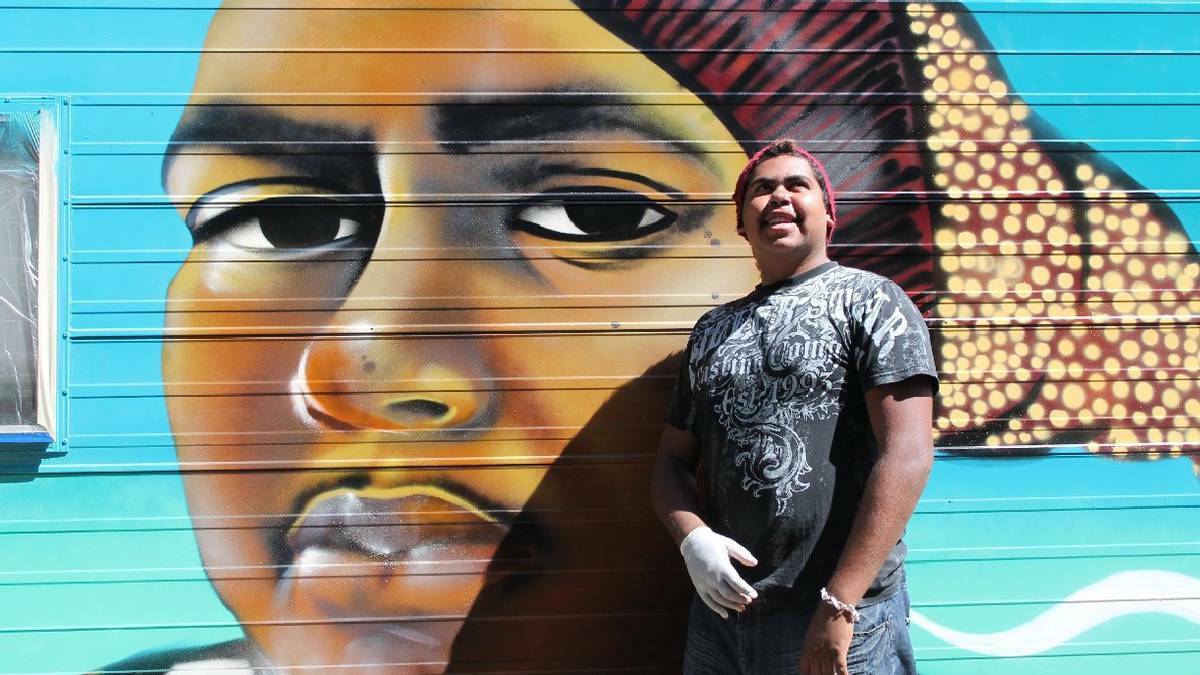 NAROOMA NEWS: Narooma Local Koori youth Warren Foster Jnr with his likeness painted in the side of “Patty” the medical outreach van. Graffiti artist Ash Johnston came to Katungul Aboriginal health service to help teach local young peer educators the “Your Mob, My Mob, Our Mob” program.