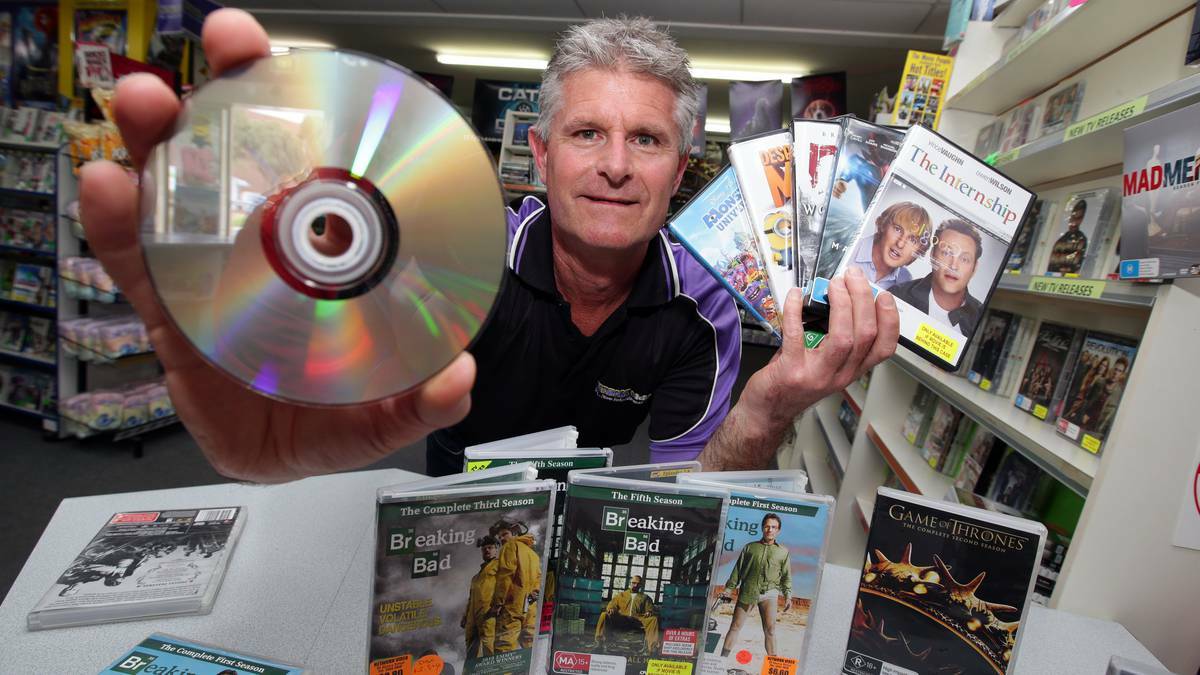 THE STANDARD (WARRNAMBOOL): Henna Street Movies owner operator Andrew Clarke shows some of the latest popular TV series. Picture: DAMIAN WHITE