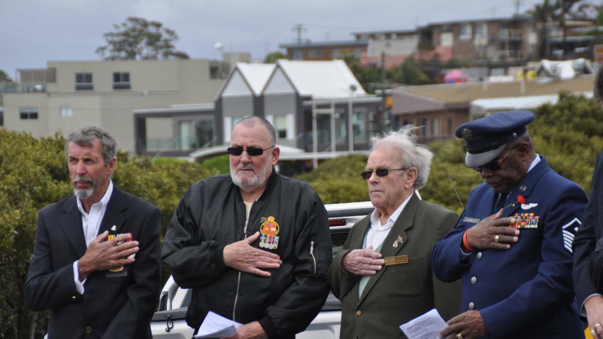 MERIMBULA NEWS WEEKLY: Merimbula RSL Sub- branch members pay their respects to the fallen on Remembrance Day. Phil Hall, left, Kevin Webb, WWII veteran, Bob O’ Donnell and Lonnie Llewellyn.
