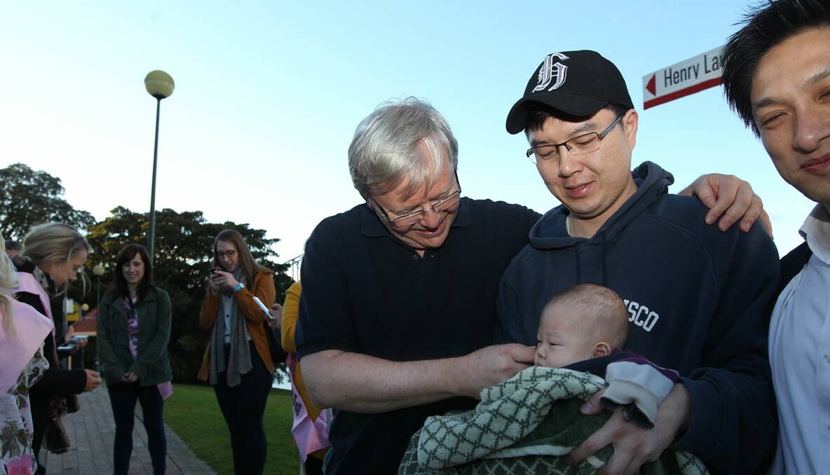 Baby kissing time for PM Kevin Rudd as he campaigned with Bennelong candidate Jason Li. Photo: Jacky Ghossein 