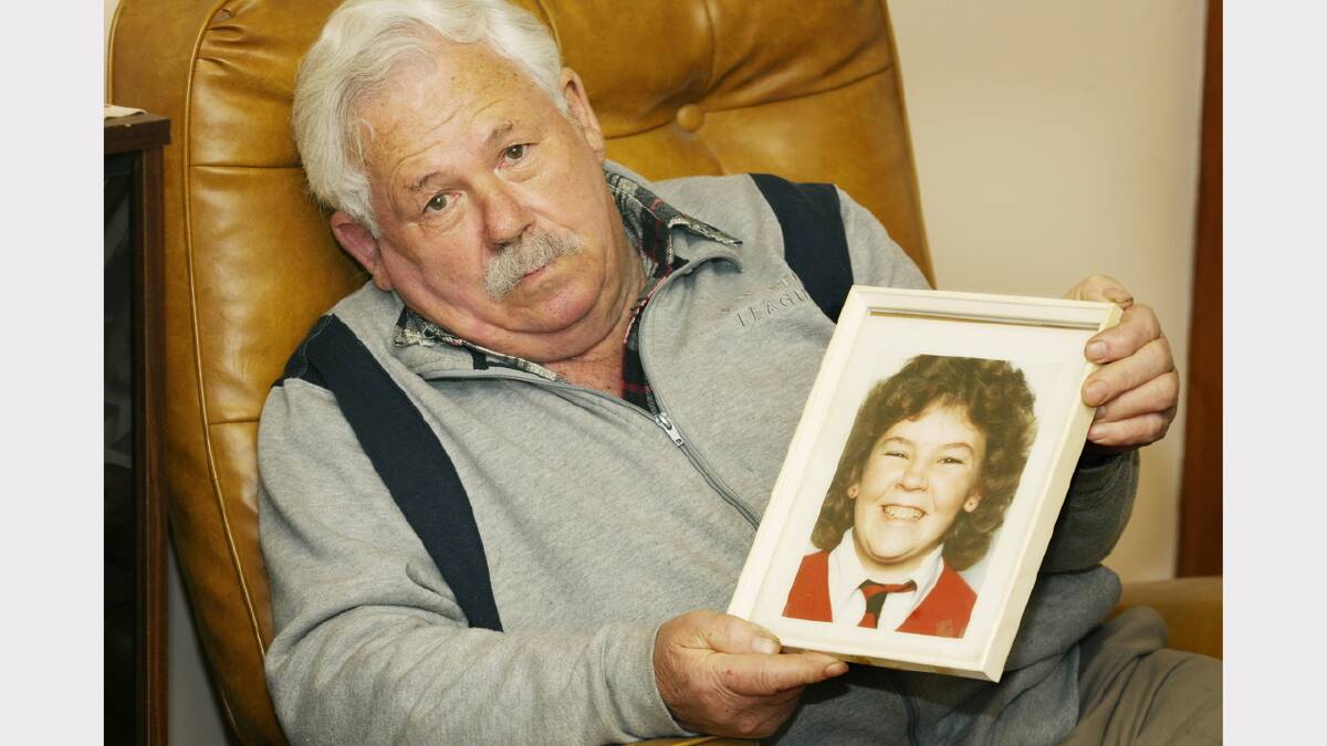 Lawrence Charlton with a picture of his daughter Faye Charlton.