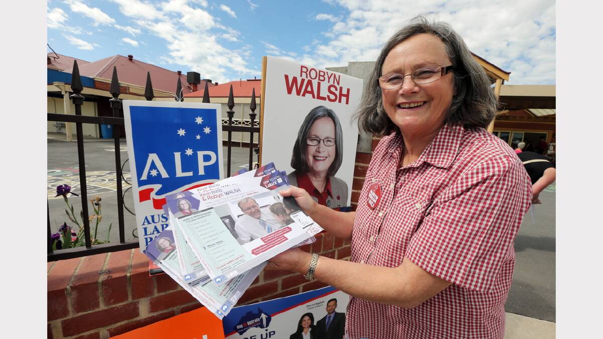 11.45am: Indi Labor candidate Robyn Walsh hands out a how-to-vote card at St Augustine's Primary School in Wodonga.