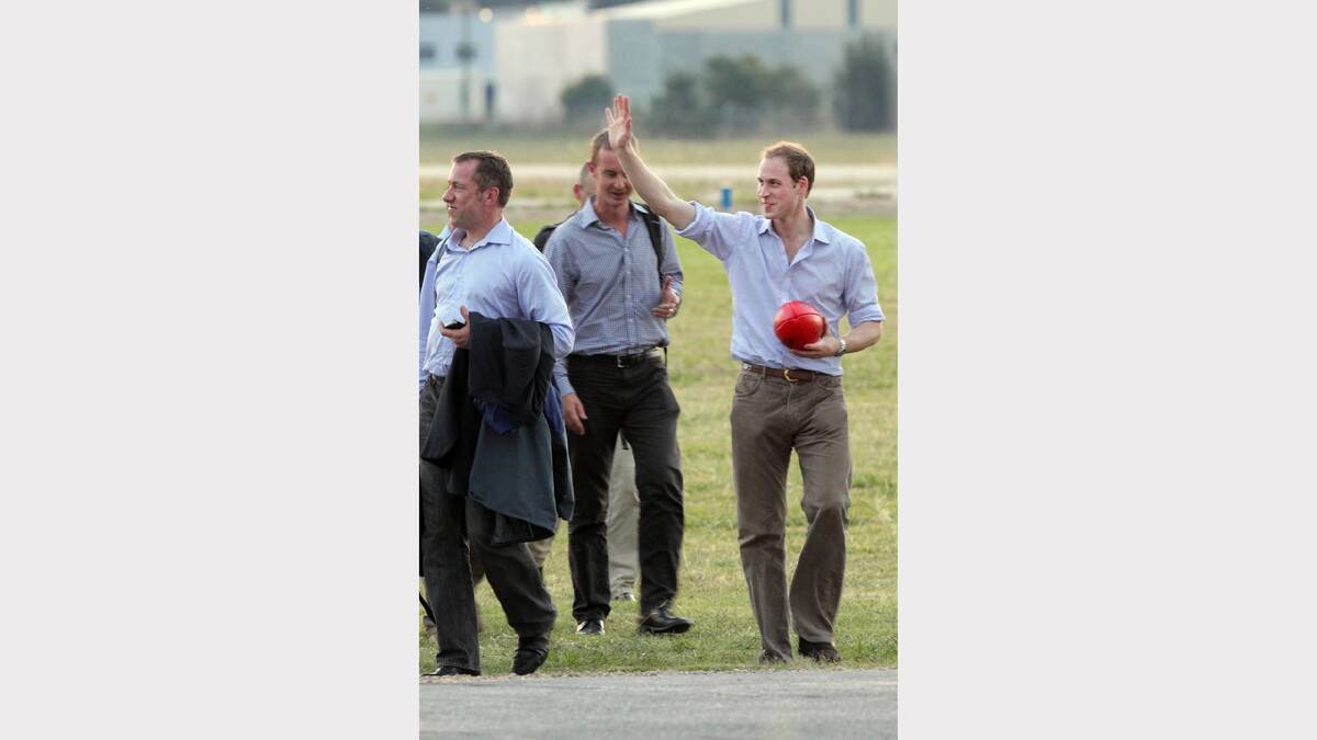 Prince William made a stop-over at Albury airport in March 2011, on his way back from visiting flood victims in Kerang. He is pictured throwing around a footy, which he was given as a gift in Kerang, and waving to the crowd of people.