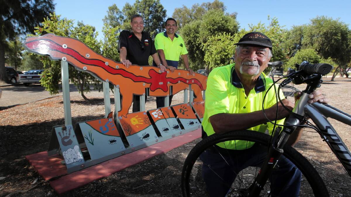 Ollie Patten and Martin Patten with Aboriginal corporation chief Matt Burke are delighted with their new bike racks. Picture: DAVID THORPE