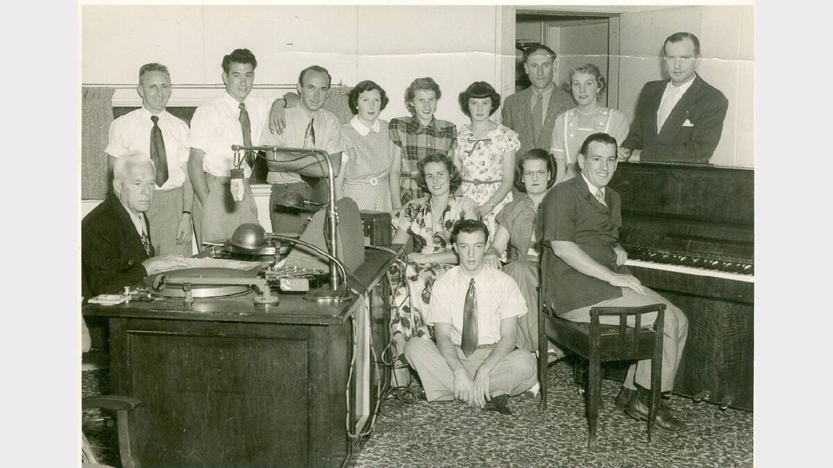 Staff of Radio 2AY in the 1950s included George Jennings, seated left, and the station manager from 1946 to 1963, Ray Kidd, standing, right. ALL PICTURES (unless specified): THE HOWARD JONES COLLECTION