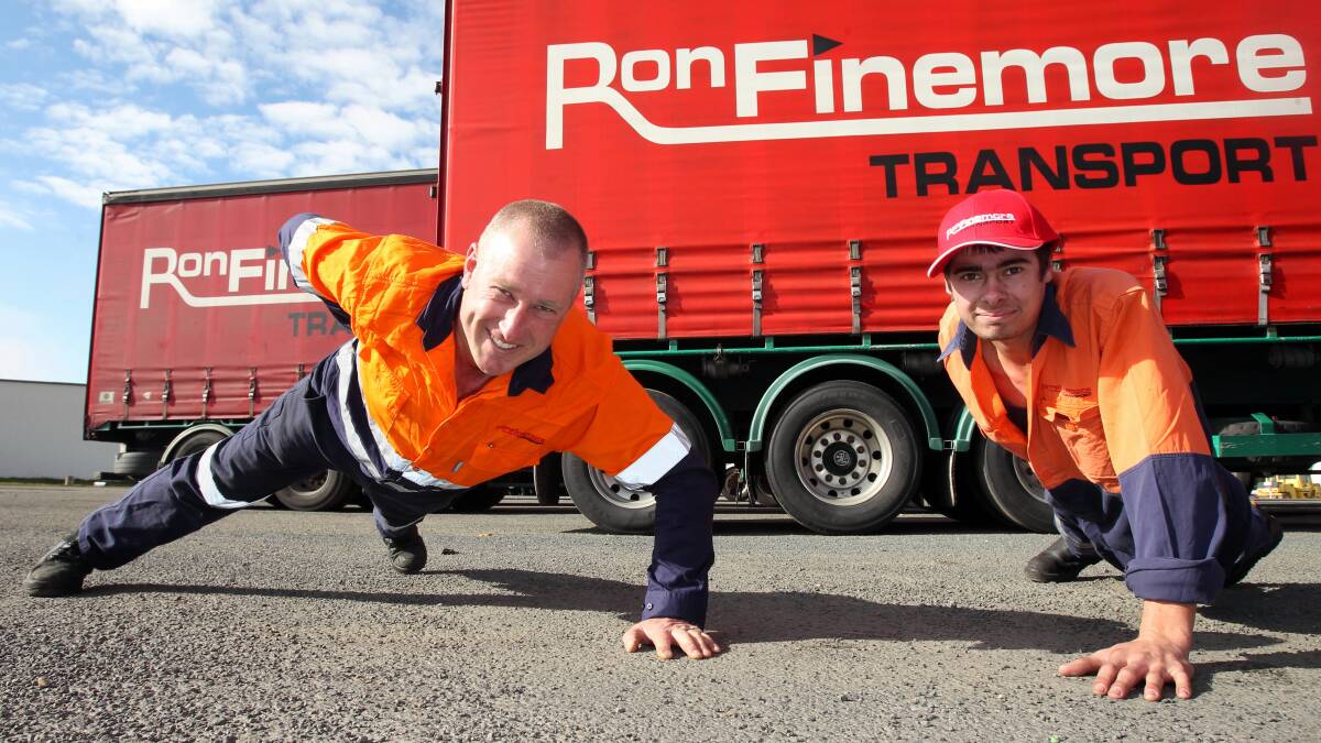 On the move ... Ron Finemore Transport driver Ray Pitt and maintenance worker Nigel Franks get active as part of the company’s outlook on health and well-being. 